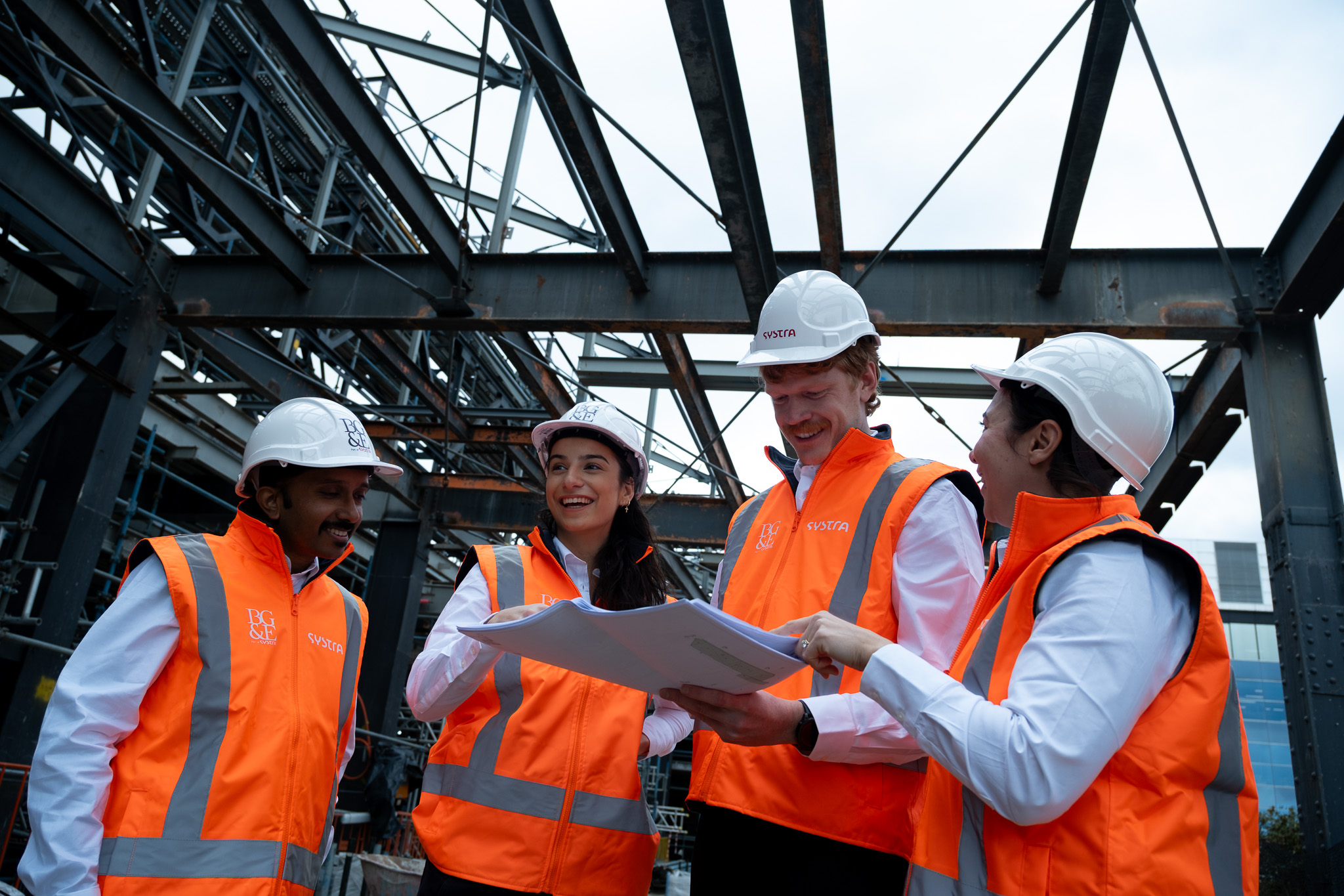 BG&E and SYSTRA engineers reviewing drawings on a construction site